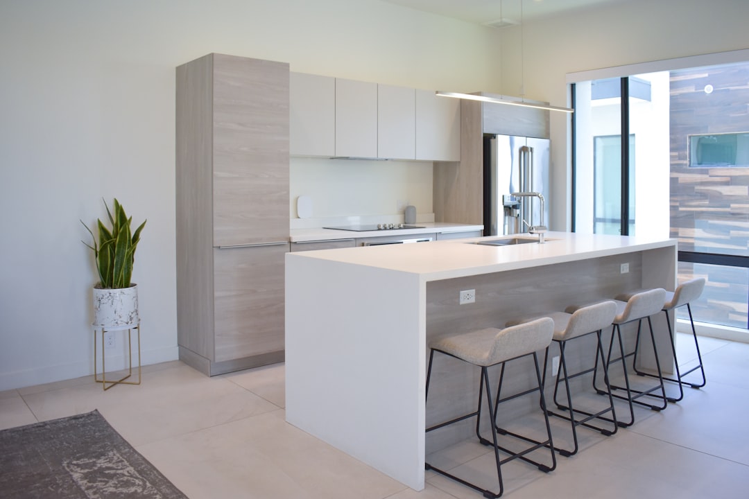 A close-up detail shot of a modern kitchen with clean lines and natural light, highlighting the quality of professional real estate photography.